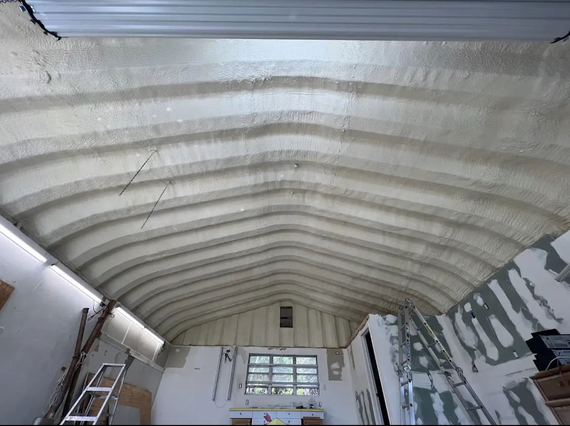 Spray polyurethane foam applied to the underside of a metal roof deck in Independence